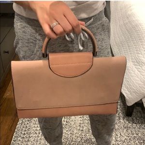 Pink clutch bag with removable strap